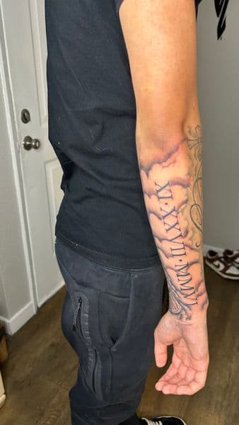 Black & Grey + Lettering roman numerals tattoo on Forearm by Slimxink on TattMe