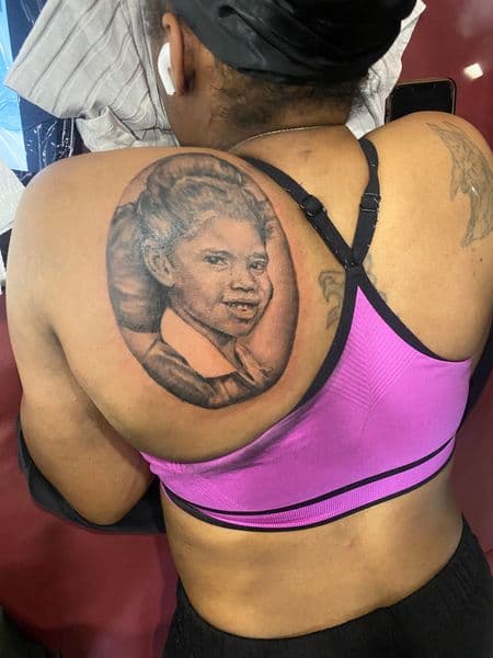 Realism + Black & Grey portrait tattoo on Upper Back by Moving_Murals on TattMe