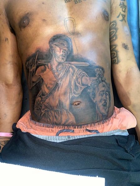 Black & Grey + Realism blindfolded figure tattoo on Stomach by Moving_Murals on TattMe
