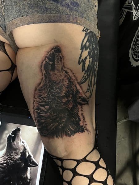 Realism + Black & Grey wolf tattoo on Thigh by Moving_Murals on TattMe