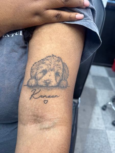Black & Grey + Illustrative puppy tattoo on Upper Arm by Rell_MadeYouInk on TattMe