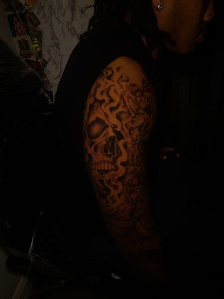 Black & Grey + Illustrative skull tattoo on Upper Arm by Inkbymira on TattMe