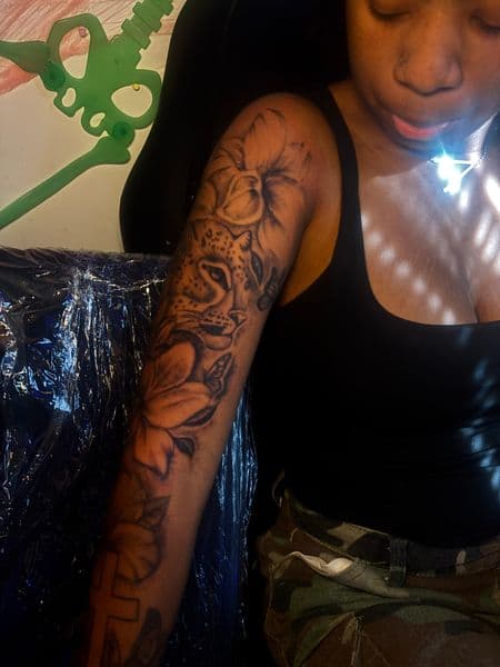 Black & Grey + Illustrative leopard tattoo on Half Sleeve by Inkbymira on TattMe