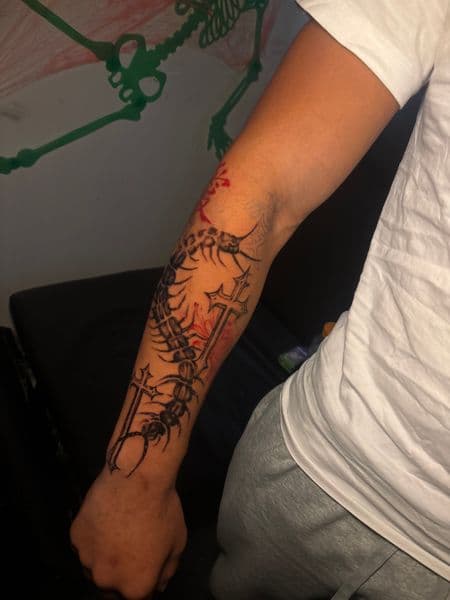 Black-work + Illustrative centipede tattoo on Forearm by Inkbymira on TattMe