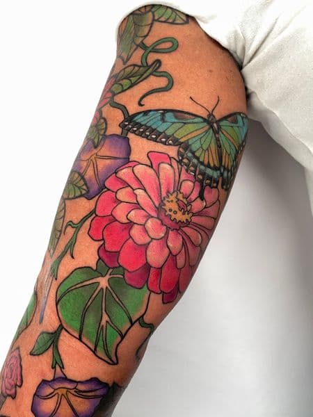 Color + Floral butterfly tattoo on Upper Arm by darya on TattMe