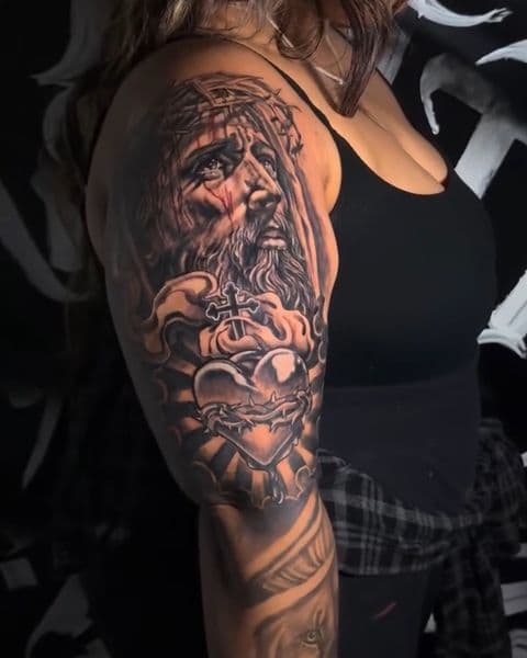 Realism + Black & Grey jesus christ tattoo on Upper Arm by DON_X_TATTOOS on TattMe