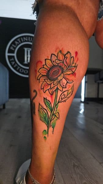 Watercolor + Illustrative sunflower tattoo on Calf by Mane_Creation_Studios on TattMe