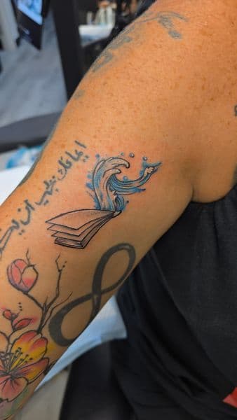 Illustrative + Color book tattoo on Upper Arm by Mane_Creation_Studios on TattMe