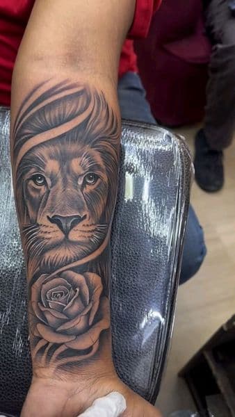 Black & Grey + Realism lion tattoo on Forearm by vontattoos on TattMe